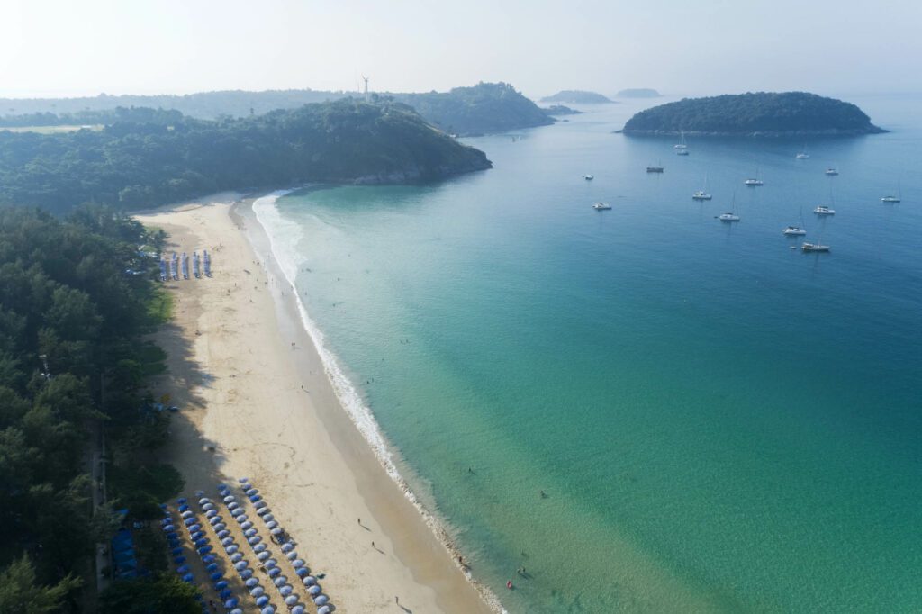 When should you visit Nai Harn to enjoy the beach?